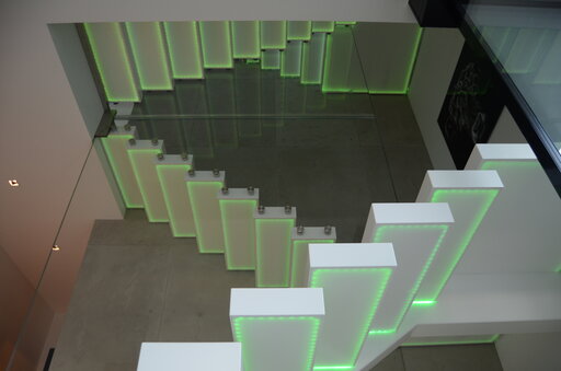 Corian LED – Floating cantilever staircase with integrated lighting design