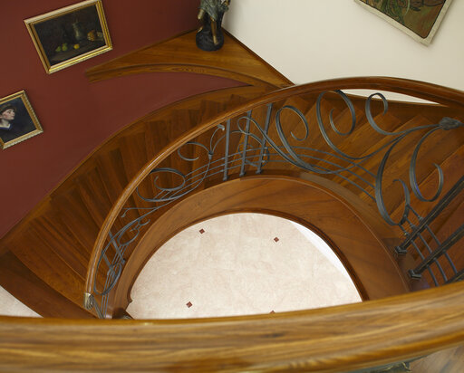 Wrought iron railing with wooden handrail